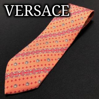 ジャンニヴェルサーチ(Gianni Versace)のヴェルサーチ 切替ロゴドット オレンジ ネクタイ 黒タグ A101-W24(ネクタイ)