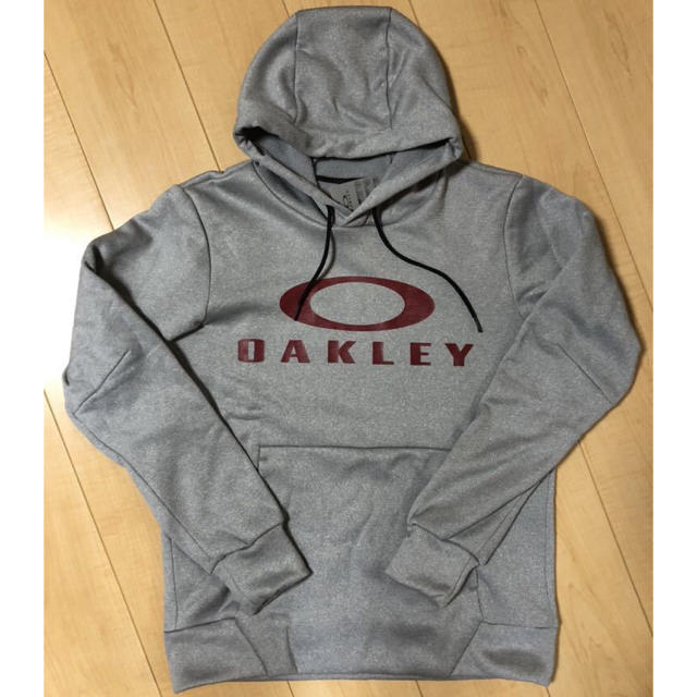 Oakley(オークリー)のオークリー　エンハンス　テクニカル　フリース　フーディー　グレー　S メンズのトップス(パーカー)の商品写真