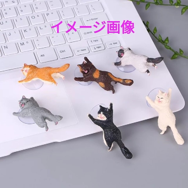 猫が支える　スマホスタンド　単品　オレンジ スマホ/家電/カメラのスマホアクセサリー(その他)の商品写真