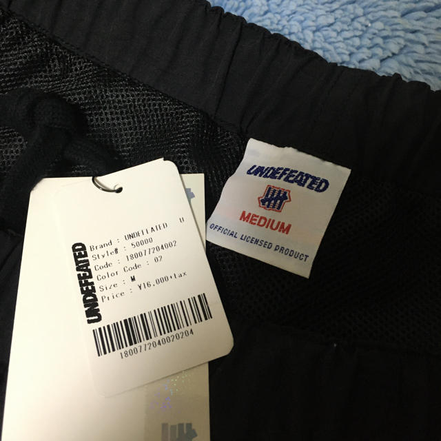 UNDEFEATED(アンディフィーテッド)の中古美品 サイズＭ undefeated warm up pant メンズのパンツ(その他)の商品写真