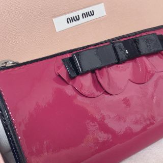 ミュウミュウ(miumiu)の MIU MIU  L字ファスナー リボン フリル 長財布ミュウミュウラス1(財布)