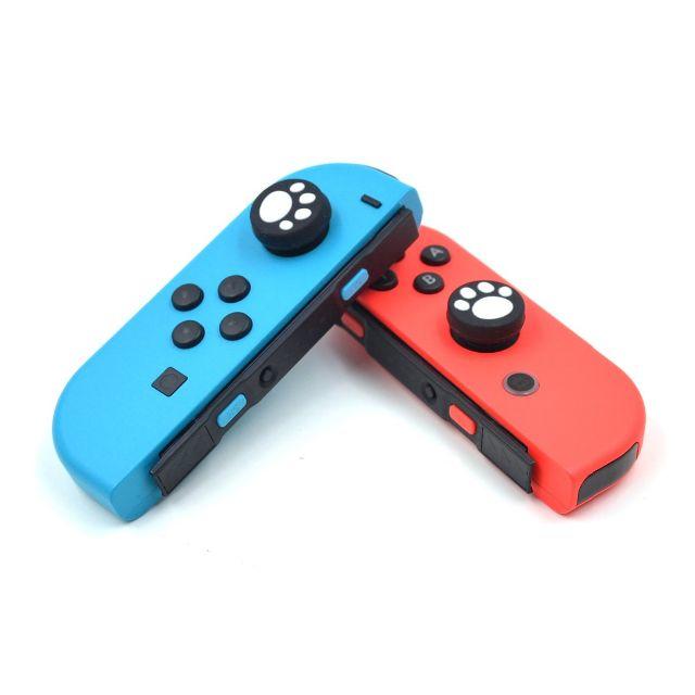 Nintendo Switch(ニンテンドースイッチ)のSwitch Joy-Con カバー 猫 肉球 ねこ ジョイコン スティック 白 エンタメ/ホビーのゲームソフト/ゲーム機本体(家庭用ゲーム機本体)の商品写真