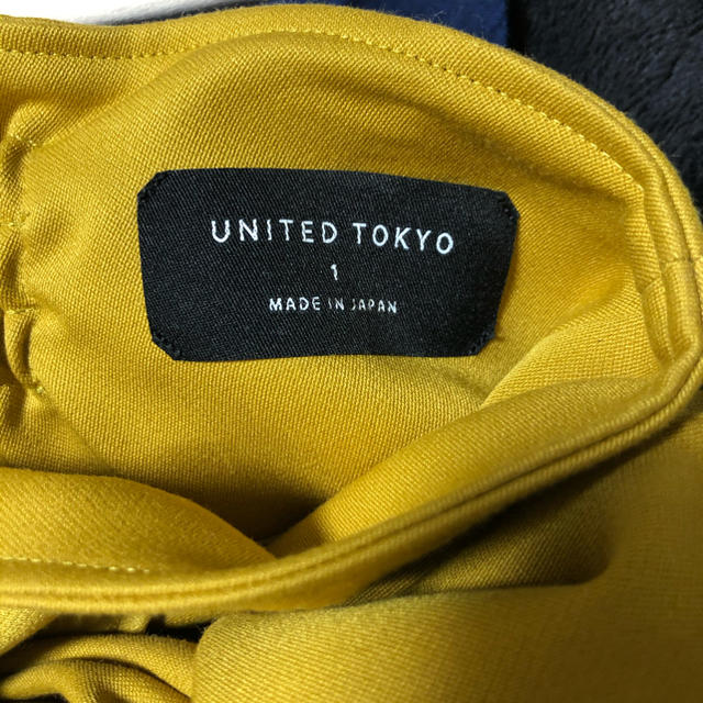 UNITED ARROWS(ユナイテッドアローズ)のunited tokyo デコラティブノットスカート　イエロー レディースのスカート(ひざ丈スカート)の商品写真