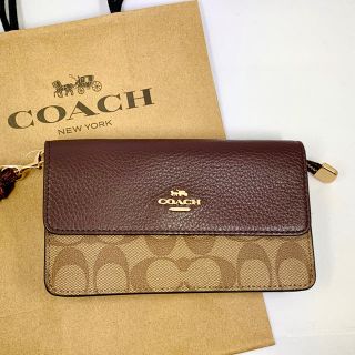 コーチ(COACH)の[COACH]シグネチャー長財布 スマホケース(モバイルケース/カバー)