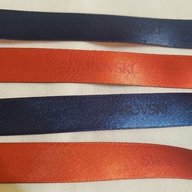 SWAROVSKI(スワロフスキー)のリボン　スワロフスキー　バイカラー　オレンジ&ネイビー インテリア/住まい/日用品のオフィス用品(ラッピング/包装)の商品写真