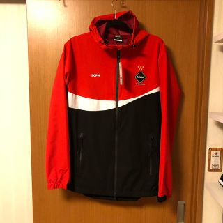 エフシーアールビー(F.C.R.B.)のF.C.R.B Coca-Cola WARM UP JACKET 赤 L 未使用(ナイロンジャケット)