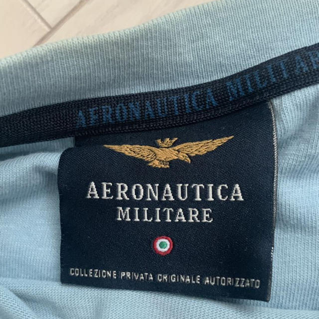 AERONAUTICA MILITARE(アエロナウティカミリターレ)のAERONAUTICAMILITARE  イタリア国旗ロゴ水色Lサイズ メンズのトップス(Tシャツ/カットソー(半袖/袖なし))の商品写真