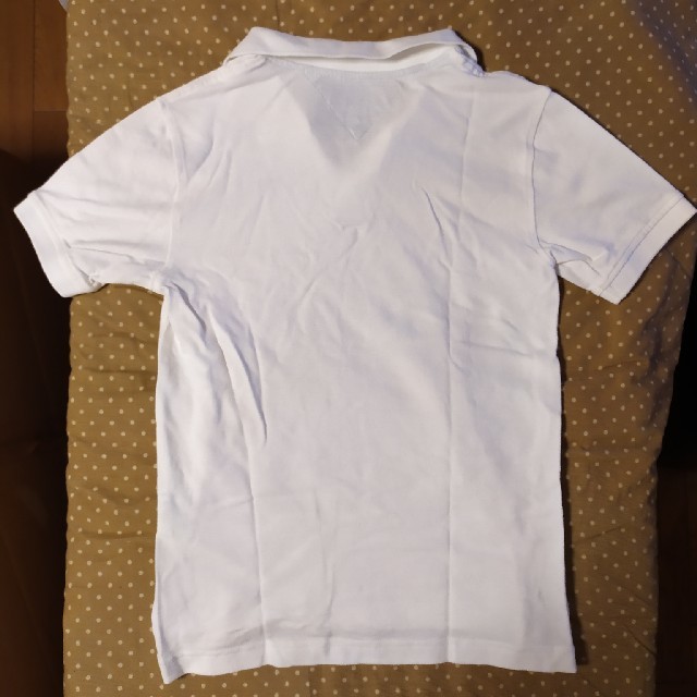 TOMMY HILFIGER(トミーヒルフィガー)のれりげさま専用　トミーヒルフィガー　ポロシャツ　キッズ　M(12-14) 白 キッズ/ベビー/マタニティのキッズ服男の子用(90cm~)(Tシャツ/カットソー)の商品写真