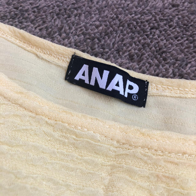 ANAP(アナップ)のANAP イエローペプラムトップス 美品 レディースのトップス(カットソー(半袖/袖なし))の商品写真