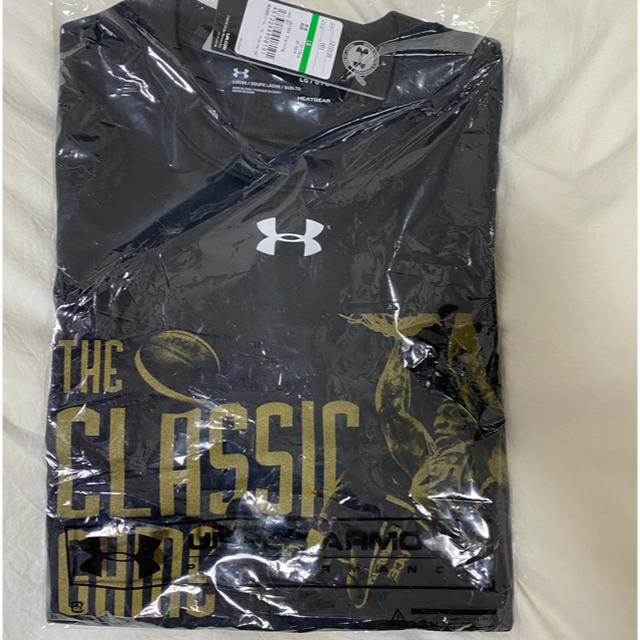 UNDER ARMOUR(アンダーアーマー)の大阪エベッサ　Tシャツ　アイラ　ブラウン メンズのトップス(Tシャツ/カットソー(半袖/袖なし))の商品写真