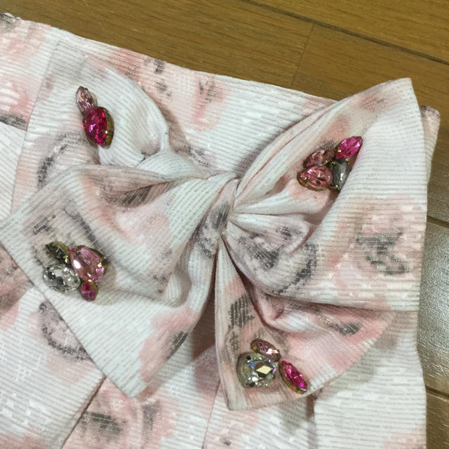 L'EST ROSE(レストローズ)のレストローズ 薔薇柄 リボン付き 巻き風スカート 2way ピンク レディースのスカート(ひざ丈スカート)の商品写真