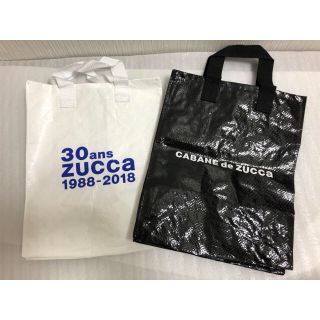 ズッカ(ZUCCa)のzucca ショッパー 中サイズ2枚セット(白(30周年)・黒)(ショップ袋)