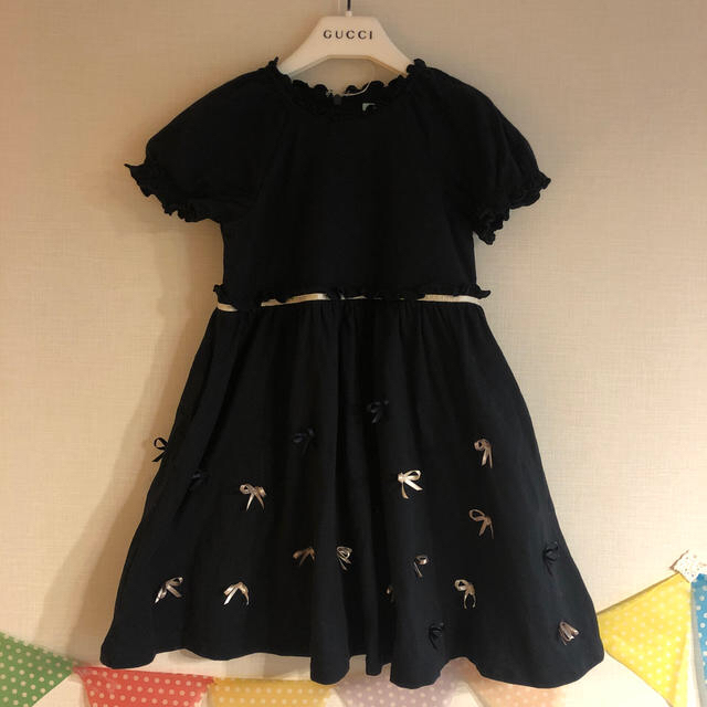 TOCCA(トッカ)の【pたん0115様専用】tocca 黒 リボン ワンピース 110 キッズ/ベビー/マタニティのキッズ服女の子用(90cm~)(ワンピース)の商品写真