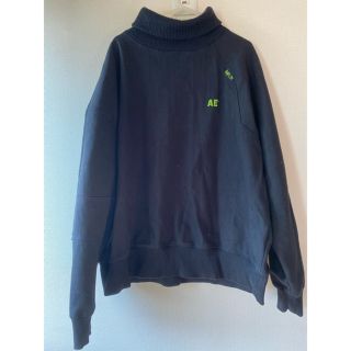 メゾンキツネ(MAISON KITSUNE')のADER ブラック タートルネック(スウェット)