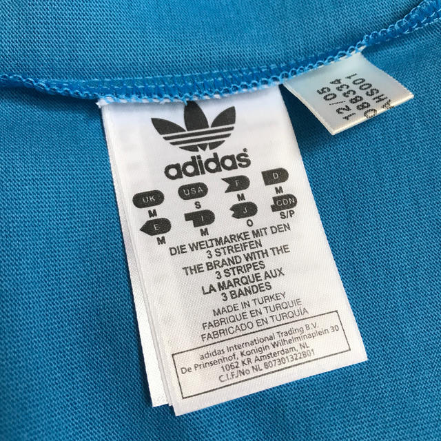 adidas(アディダス)の日本未発売　adidasオレンジ3ラインTシャツ メンズのトップス(Tシャツ/カットソー(半袖/袖なし))の商品写真