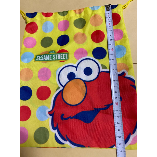 SESAME STREET(セサミストリート)のエルモ　巾着、缶ケース、リストバンド　セット エンタメ/ホビーのおもちゃ/ぬいぐるみ(キャラクターグッズ)の商品写真