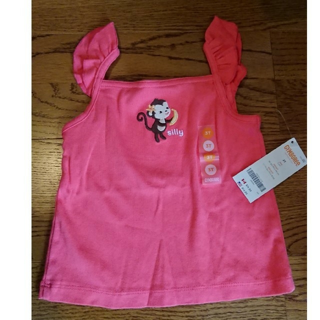 GYMBOREE(ジンボリー)の袖フリル 新品タグ付き $14.95 キッズ/ベビー/マタニティのキッズ服女の子用(90cm~)(Tシャツ/カットソー)の商品写真