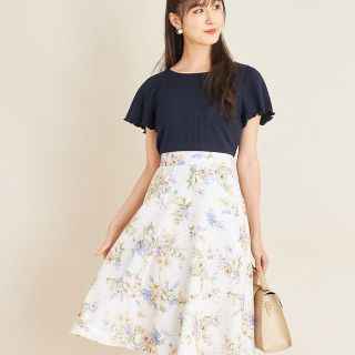 トッコ(tocco)のウエストりぼん付き袖口メローリブカットソー×フラワープリントドッキングワンピース(ひざ丈ワンピース)