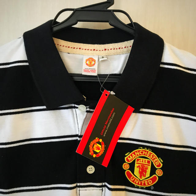 ウルトラソウル様　未使用タグ付き　MANCHESTER UNITED ポロシャツ メンズのトップス(ポロシャツ)の商品写真