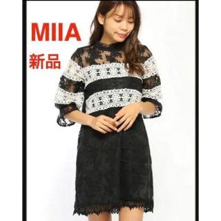 ミーア(MIIA)の【新品】未使用タグ付き　MIIA ミーア　レース切換えサックワンピース ブラック(ミディアムドレス)