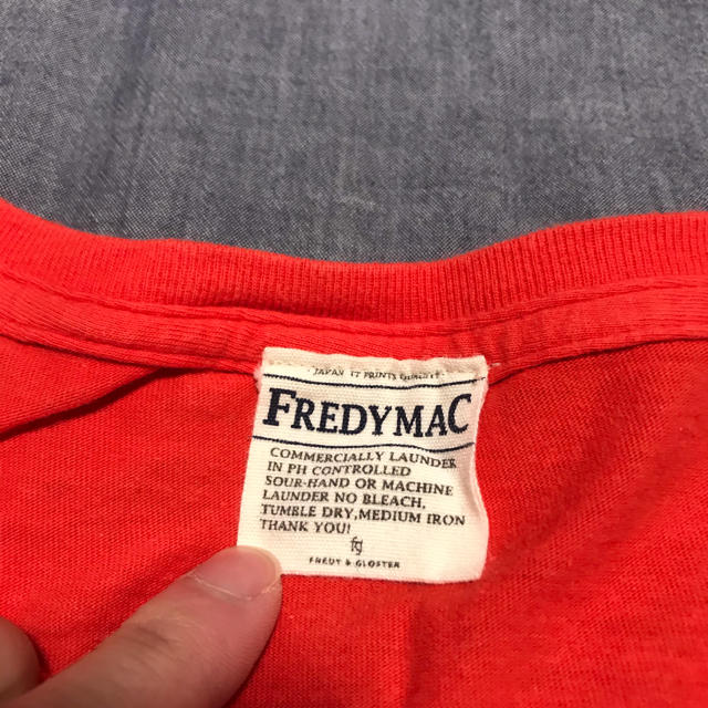 FREDY & GLOSTER(フレディアンドグロスター)のFREDY MAC Tシャツ オレンジ Mサイズ メンズのトップス(Tシャツ/カットソー(半袖/袖なし))の商品写真