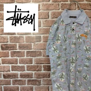 ステューシー(STUSSY)の《ステューシー》パープル系　総柄　ワンポイントロゴ　鹿の子　ポロシャツ(ポロシャツ)