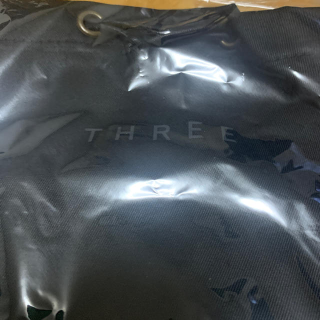 THREE(スリー)のthree オリジナル　ドローストリングバック　ノベリティ　 エンタメ/ホビーのコレクション(ノベルティグッズ)の商品写真