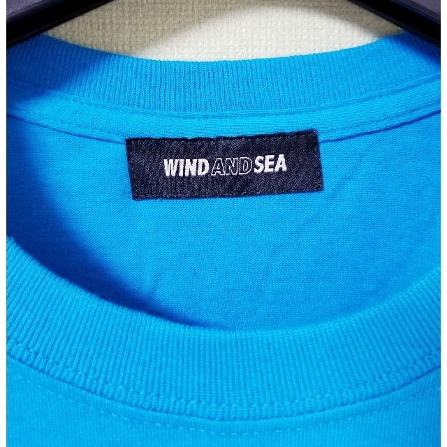 SEA(シー)のWIND AND SEA　Tシャツ ブルー サイズL　訳あり メンズのトップス(Tシャツ/カットソー(半袖/袖なし))の商品写真