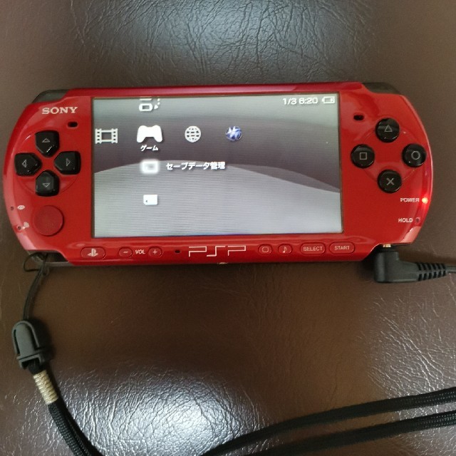 PlayStation Portable(プレイステーションポータブル)のPSP-3000 XRBレッド/ブラックとウイイレ2012のセット エンタメ/ホビーのゲームソフト/ゲーム機本体(携帯用ゲーム機本体)の商品写真