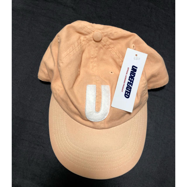 UNDEFEATED(アンディフィーテッド)の【新品　タグ付き】アンディフーテッド　キャップ　ピンク メンズの帽子(キャップ)の商品写真