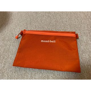 モンベル(mont bell)のモンベル 新品未使用 ペーパーポーチ Mサイズ オレンジ アウトドア キャンプ(登山用品)