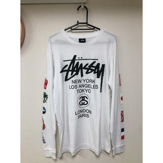ステューシー(STUSSY)のSTUSSY ロンT World Tour 国旗　2015 美品　白(Tシャツ/カットソー(七分/長袖))