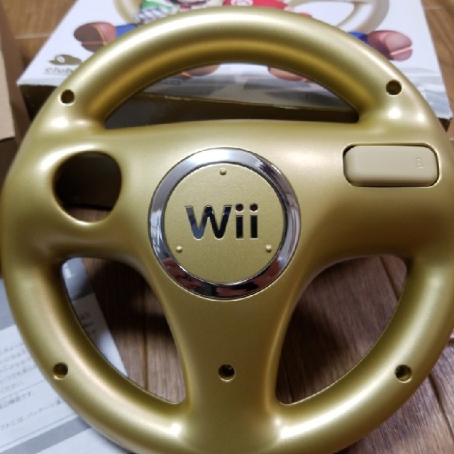 Wii(ウィー)のwii マリオカート ハンドル ゴールド エンタメ/ホビーのゲームソフト/ゲーム機本体(家庭用ゲームソフト)の商品写真