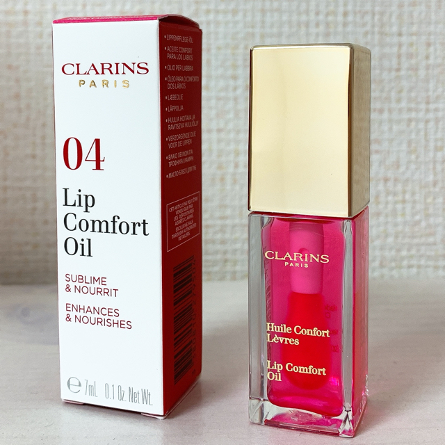 CLARINS(クラランス)のセール！【新品】クラランス　コンフォートリップオイル　04 キャンディー コスメ/美容のスキンケア/基礎化粧品(リップケア/リップクリーム)の商品写真