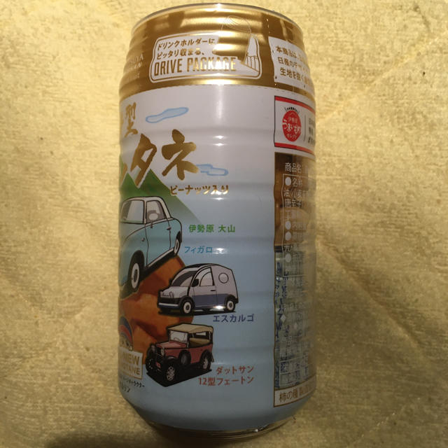 新型カキノタネ　白×金缶　(フィガロ缶) 食品/飲料/酒の食品(菓子/デザート)の商品写真