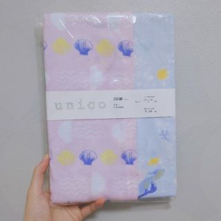 ウニコ(unico)の【新品未使用】unico ピローケース　貝やクラゲの海柄(シーツ/カバー)