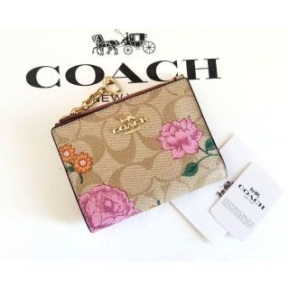 コーチ(COACH)の値下げ‼ 新品タグ付 COACH シグネチャー柄 折財布 プレーリーローズ　(財布)