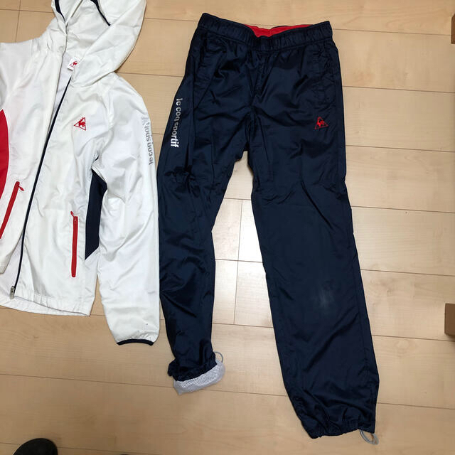 le coq sportif(ルコックスポルティフ)のルコック　スポルティフ　ウインドロングパンツ　サイズL スポーツ/アウトドアのランニング(ウェア)の商品写真