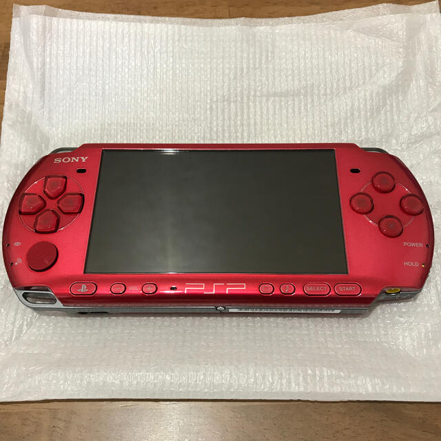 PlayStation Portable(プレイステーションポータブル)の新品未使用 PSP 3000 赤 エンタメ/ホビーのゲームソフト/ゲーム機本体(携帯用ゲーム機本体)の商品写真