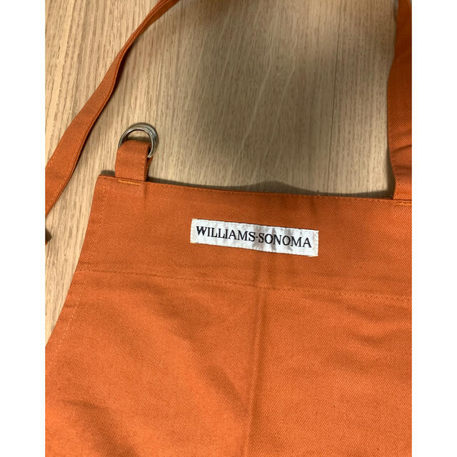 Williams-Sonoma(ウィリアムズソノマ)の値下げしましたWILLIAMS-SONOMAのエプロン（オレンジ） レディースのレディース その他(その他)の商品写真