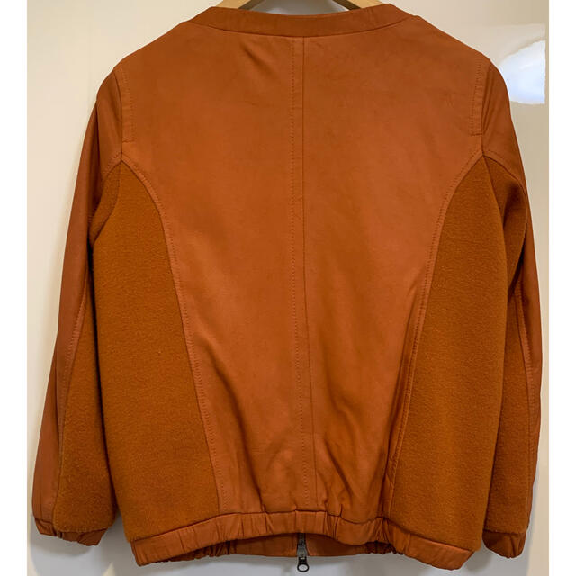 ノーカラー レザー ジャケット ブルゾン オレンジ ブラウン レディースのジャケット/アウター(ノーカラージャケット)の商品写真