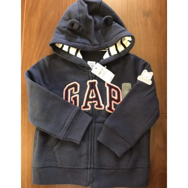 babyGAP(ベビーギャップ)の新品未使用タグ付き　ベビーギャップ  90サイズ　パーカー　ネイビー　ベビー キッズ/ベビー/マタニティのキッズ服女の子用(90cm~)(カーディガン)の商品写真