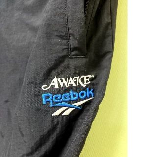 アウェイク(AWAKE)のAWAKE×Reebok ナイロンパンツ　サイズS  ブラック(デニム/ジーンズ)