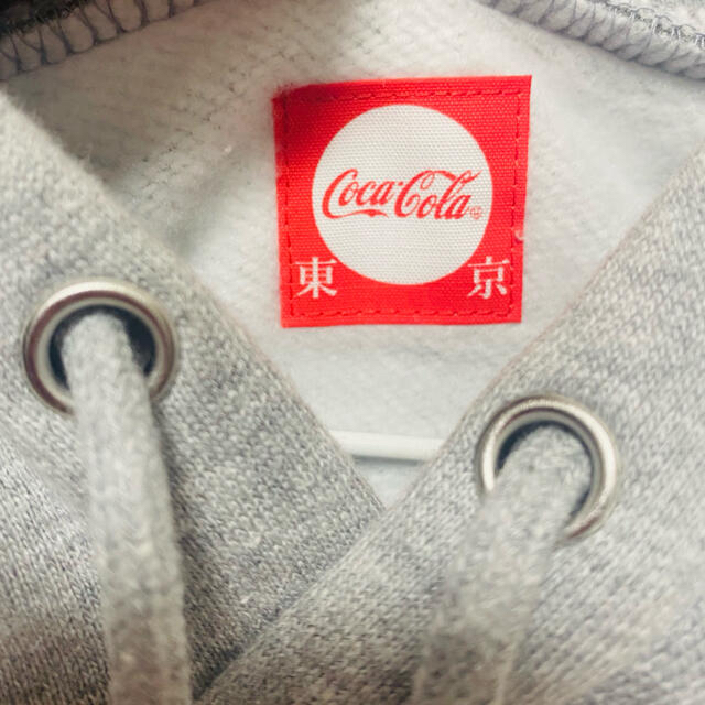 コカ・コーラ(コカコーラ)のコカコーラ×べティちゃん　パーカー　M メンズのトップス(パーカー)の商品写真