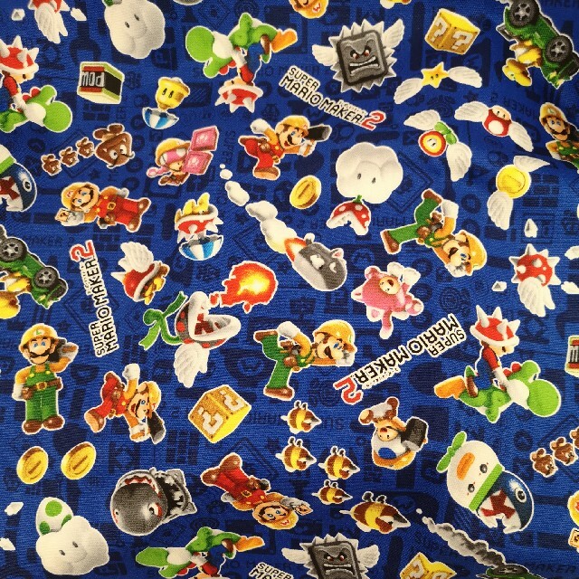 任天堂(ニンテンドウ)のマリオメーカー２ 生地 ロゴ　ブルー  はぎれ ハンドメイド 素材 55×25 ハンドメイドの素材/材料(生地/糸)の商品写真