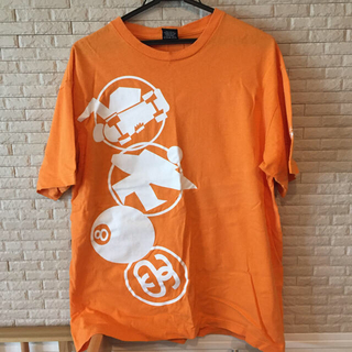 ステューシー(STUSSY)のメンズTシャツ オレンジ Lサイズ(Tシャツ/カットソー(半袖/袖なし))