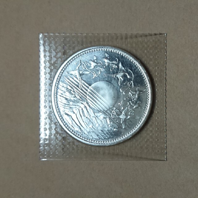天皇陛下御在位60年記念硬貨　一万円銀貨のサムネイル