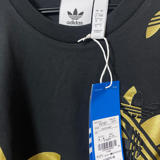 adidas(アディダス)の新品　adidas originals 黒　金ロゴ 総柄 ロンT メンズのトップス(Tシャツ/カットソー(七分/長袖))の商品写真