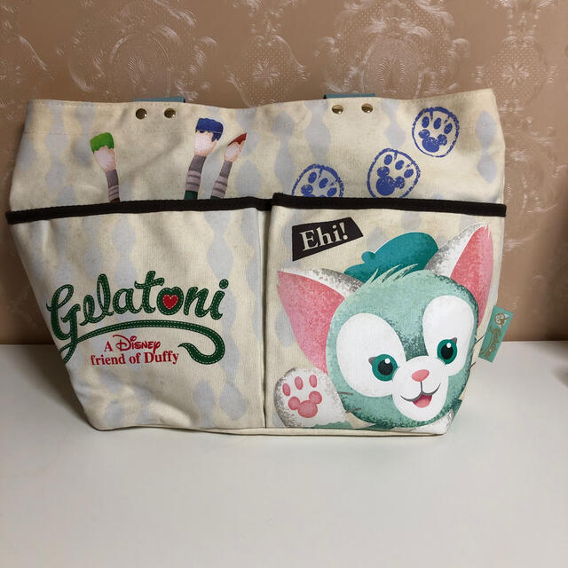 Disney(ディズニー)のまな愛ママ様専用　　ジェラトーニ　バッグ エンタメ/ホビーのおもちゃ/ぬいぐるみ(キャラクターグッズ)の商品写真