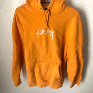 ステューシー(STUSSY)のstussy オレンジ　パーカー(パーカー)